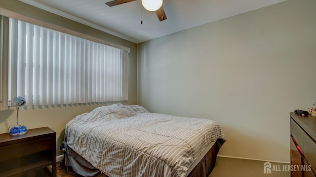 bedroom with ceiling fan and carpet flooring