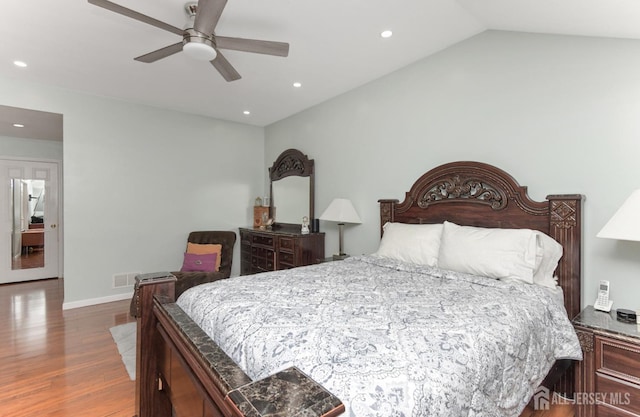 bedroom with wood finished floors, recessed lighting, baseboards, ceiling fan, and vaulted ceiling