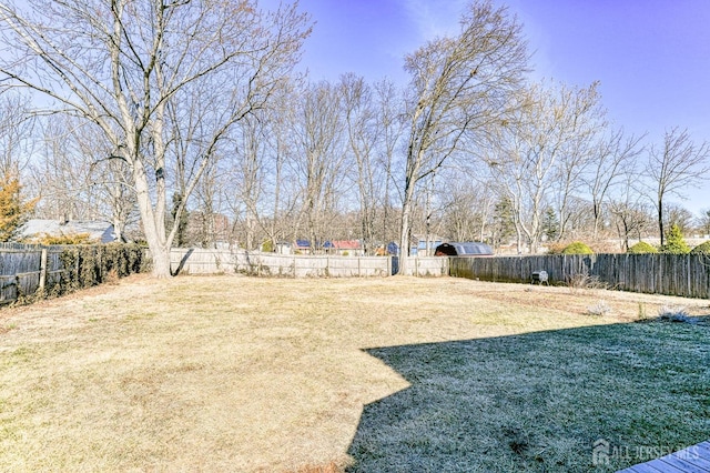 view of yard with a fenced backyard