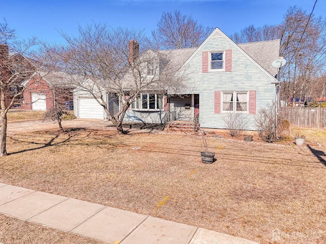 view of front of house featuring driveway, covered porch, and an attached garage