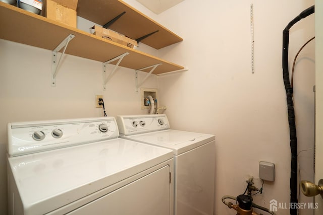 clothes washing area with laundry area and separate washer and dryer