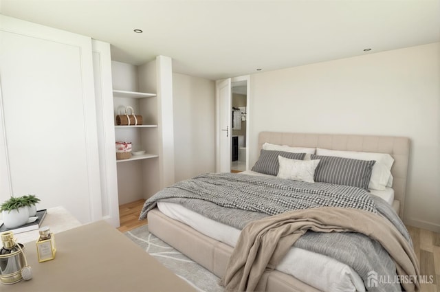 bedroom with wood finished floors