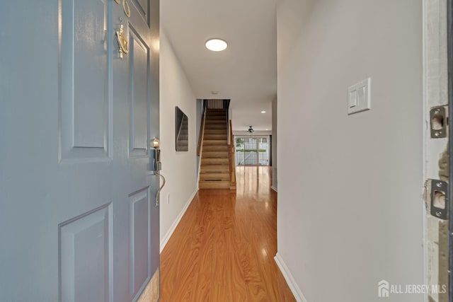 26 Desoto Dr, Franklin Twsp, NJ 08823 - hallway featuring light wood-style floors and stairs