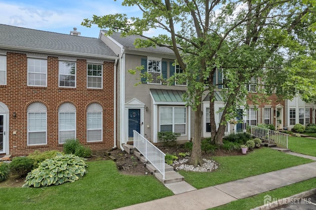 26 Desoto Dr, Franklin Twsp, NJ 08823 - townhome / multi-family property with a front yard and brick siding