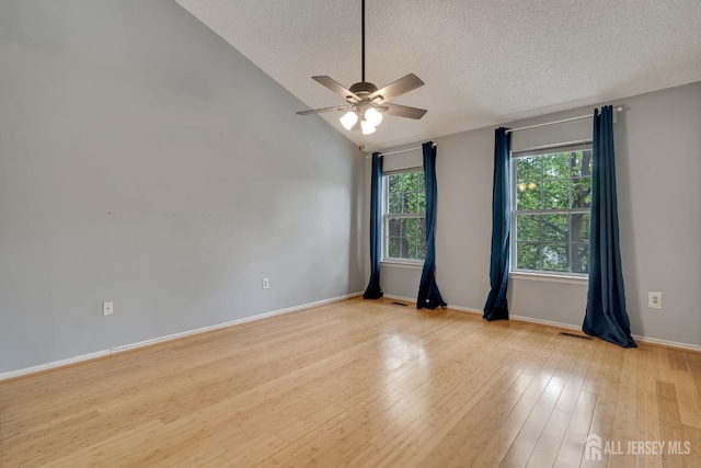 26 Desoto Dr, Franklin Twsp, NJ 08823 - unfurnished room with ceiling fan, a textured ceiling, lofted ceiling, and light wood-style floors