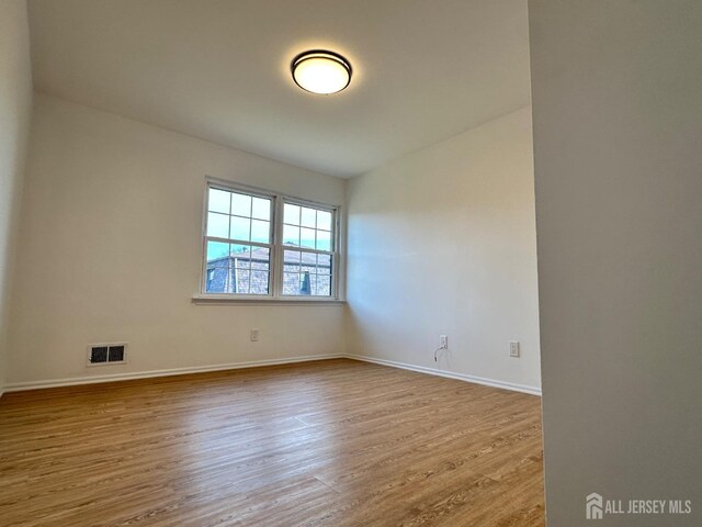 299 Alpine Way Unit C, Woodbridge Proper, NJ 07095 - unfurnished room featuring wood finished floors and baseboards