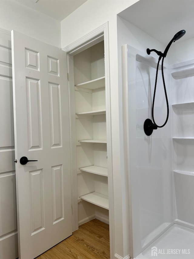 299 Alpine Way Unit C, Woodbridge Proper, NJ 07095 - bathroom featuring a shower and wood finished floors