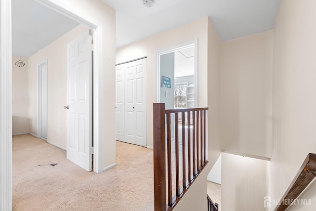 135 Archery Ct, Old Bridge, NJ 08857 - corridor with baseboards, carpet flooring, and an upstairs landing