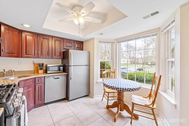 135 Archery Ct, Old Bridge, NJ 08857 - kitchen featuring a healthy amount of sunlight, visible vents, appliances with stainless steel finishes, a sink, and a raised ceiling