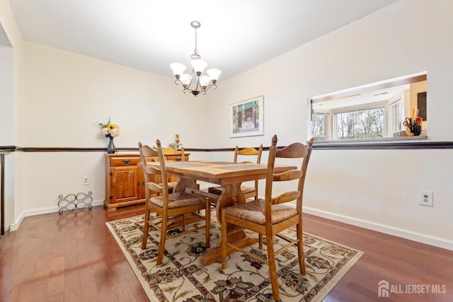 135 Archery Ct, Old Bridge, NJ 08857 - dining space with baseboards, an inviting chandelier, and wood finished floors