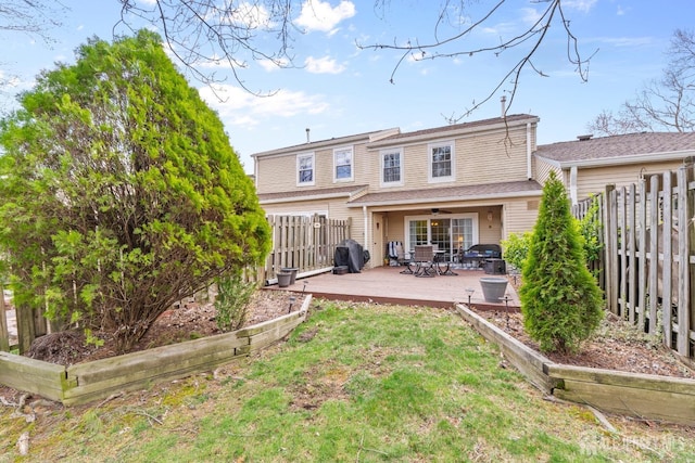 135 Archery Ct, Old Bridge, NJ 08857 - rear view of property with a lawn, a ceiling fan, a fenced backyard, and a deck