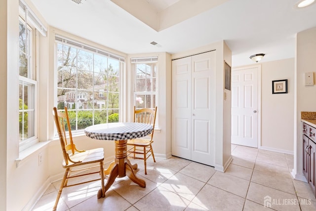 135 Archery Ct, Old Bridge, NJ 08857 - dining area with baseboards, light tile patterned flooring, and a healthy amount of sunlight