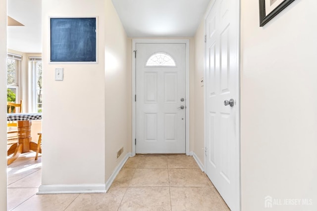 135 Archery Ct, Old Bridge, NJ 08857 - doorway to outside featuring baseboards, light tile patterned flooring, and visible vents