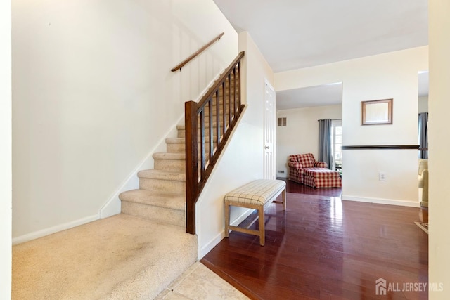135 Archery Ct, Old Bridge, NJ 08857 - stairway featuring baseboards, wood finished floors, and visible vents