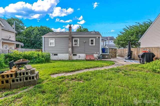 426 Catherine St, South Amboy, NJ 08879 - rear view of house featuring a chimney