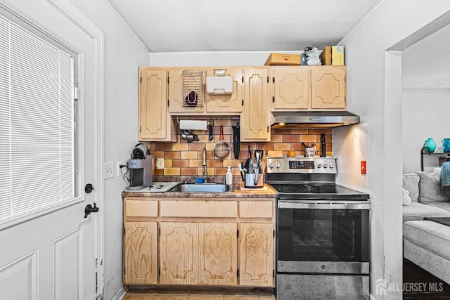 426 Catherine St, South Amboy, NJ 08879 - kitchen featuring stainless steel electric stove, under cabinet range hood, a sink, backsplash, and light brown cabinets