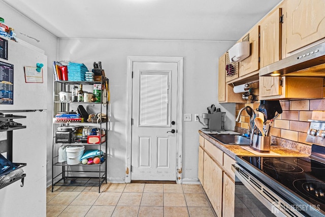 426 Catherine St, South Amboy, NJ 08879 - kitchen with range with electric cooktop, light tile patterned floors, a sink, and under cabinet range hood