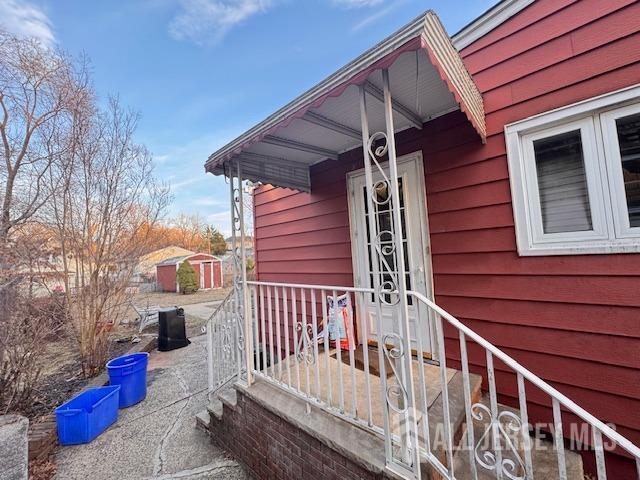 view of property exterior with a shed