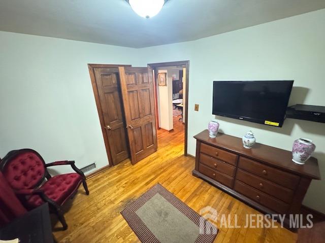 bedroom with light wood-style floors