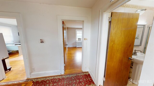 corridor featuring light hardwood / wood-style flooring