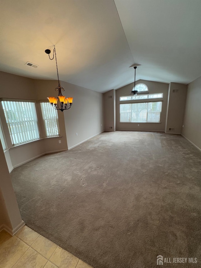 interior space with ceiling fan with notable chandelier, lofted ceiling, and light carpet