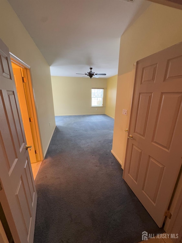 hallway featuring carpet flooring