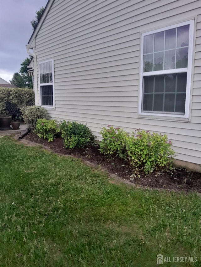 view of home's exterior featuring a yard