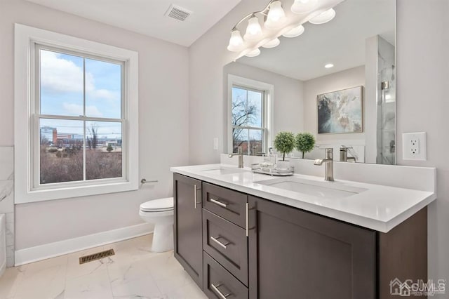 full bathroom featuring visible vents, marble finish floor, and a sink