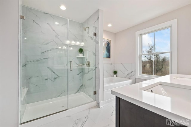 full bath featuring a bath, a sink, recessed lighting, a marble finish shower, and marble finish floor