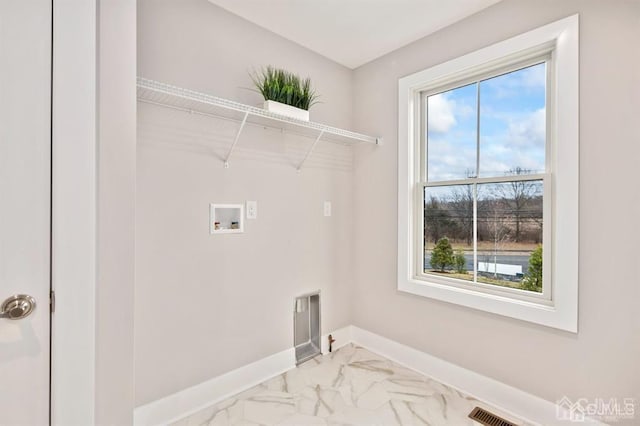washroom featuring laundry area, hookup for a washing machine, visible vents, marble finish floor, and baseboards