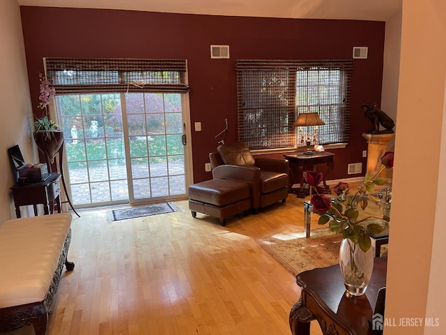 living area with light hardwood / wood-style flooring