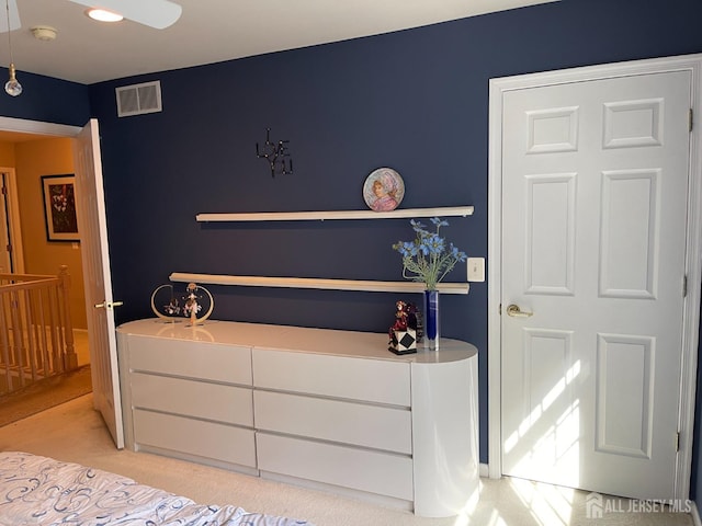 bedroom featuring light carpet