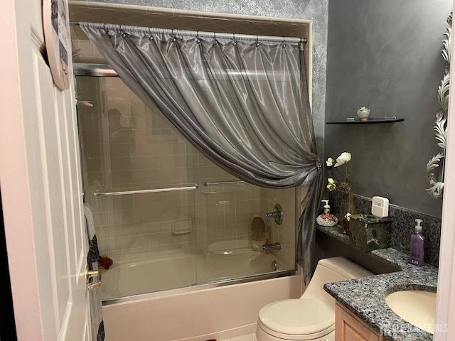 full bathroom with vanity, shower / bath combination with glass door, and toilet