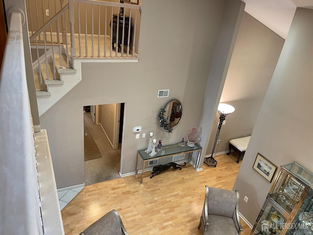 stairs featuring hardwood / wood-style flooring