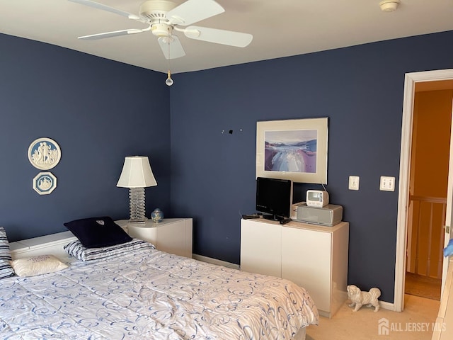 carpeted bedroom featuring ceiling fan