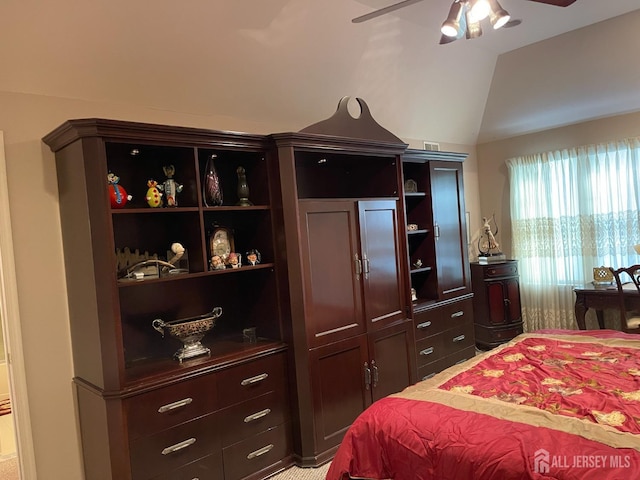 bedroom with ceiling fan and lofted ceiling