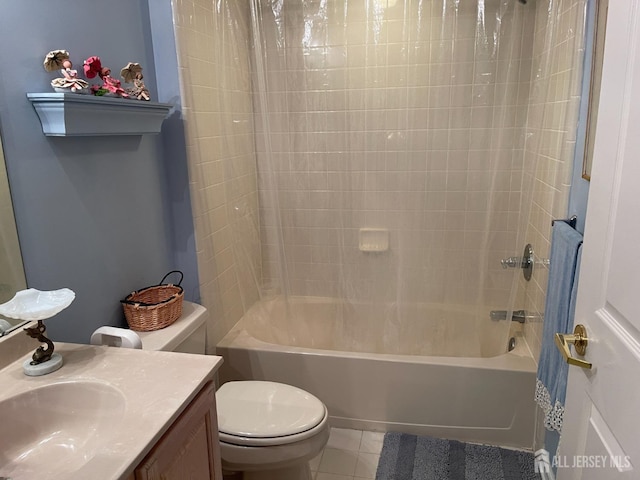 full bathroom with tile patterned flooring, toilet, vanity, and shower / bath combo with shower curtain