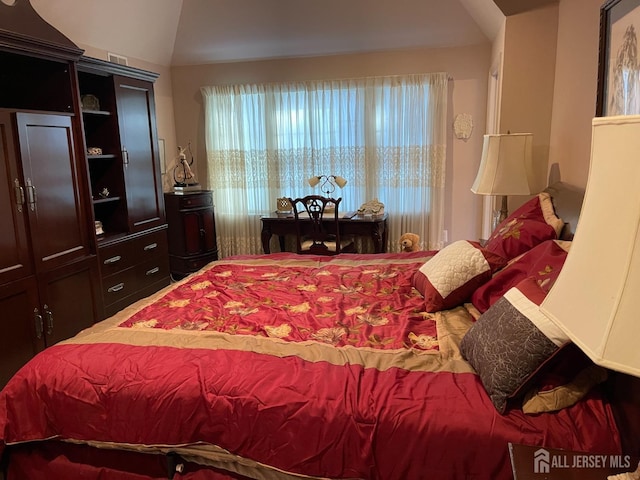 bedroom featuring lofted ceiling