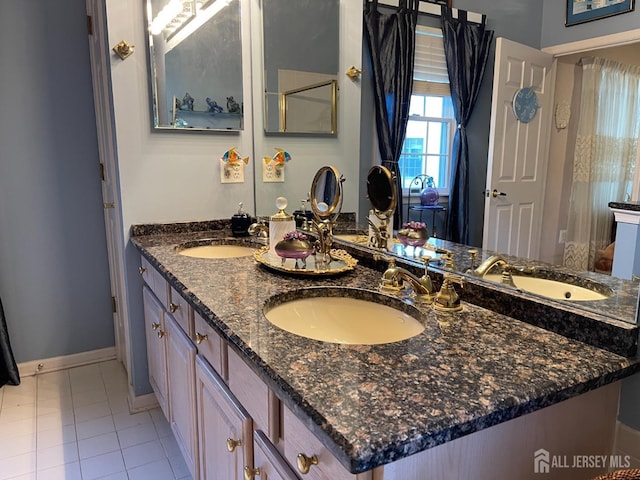 bathroom featuring vanity and tile patterned flooring