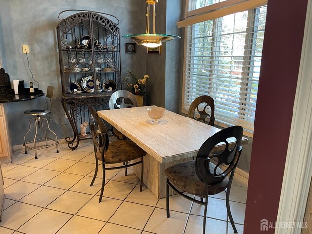 dining area with light tile patterned floors