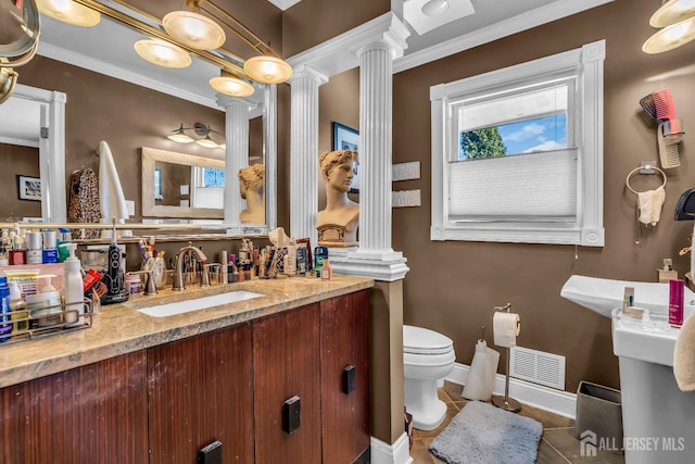 bathroom featuring vanity, tile patterned floors, toilet, and ornate columns