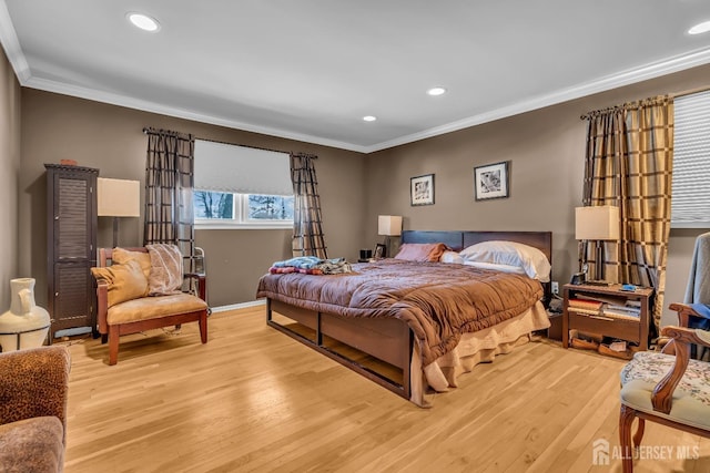 bedroom featuring crown molding and light wood-type flooring