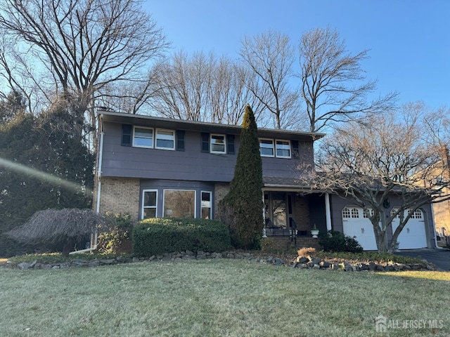 front of property with a garage and a front yard