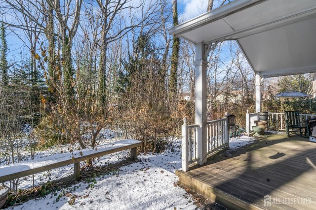 view of snow covered deck