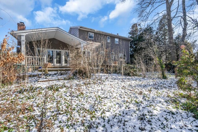 view of snow covered property