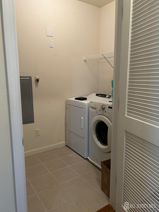 4207 Cedar Village Blvd, East Brunswick, NJ 08816 - washroom with electric panel, washing machine and dryer, and light tile patterned floors
