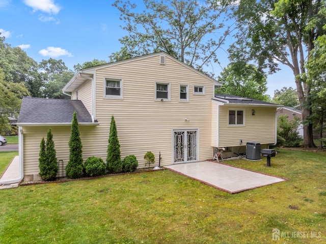 14 Bosko Dr, East Brunswick, NJ 08816 - back of property featuring a patio area, a yard, a shingled roof, and french doors