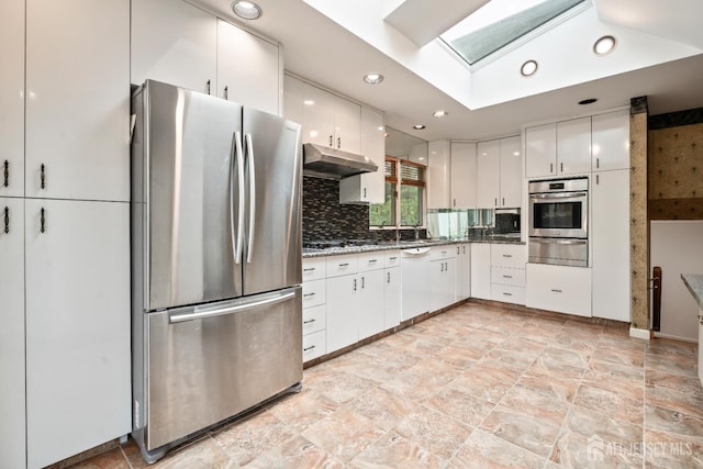 14 Bosko Dr, East Brunswick, NJ 08816 - kitchen with stainless steel appliances, a warming drawer, under cabinet range hood, white cabinetry, and a skylight