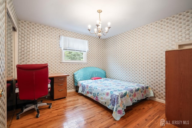 14 Bosko Dr, East Brunswick, NJ 08816 - bedroom with a chandelier, light wood-style flooring, and wallpapered walls