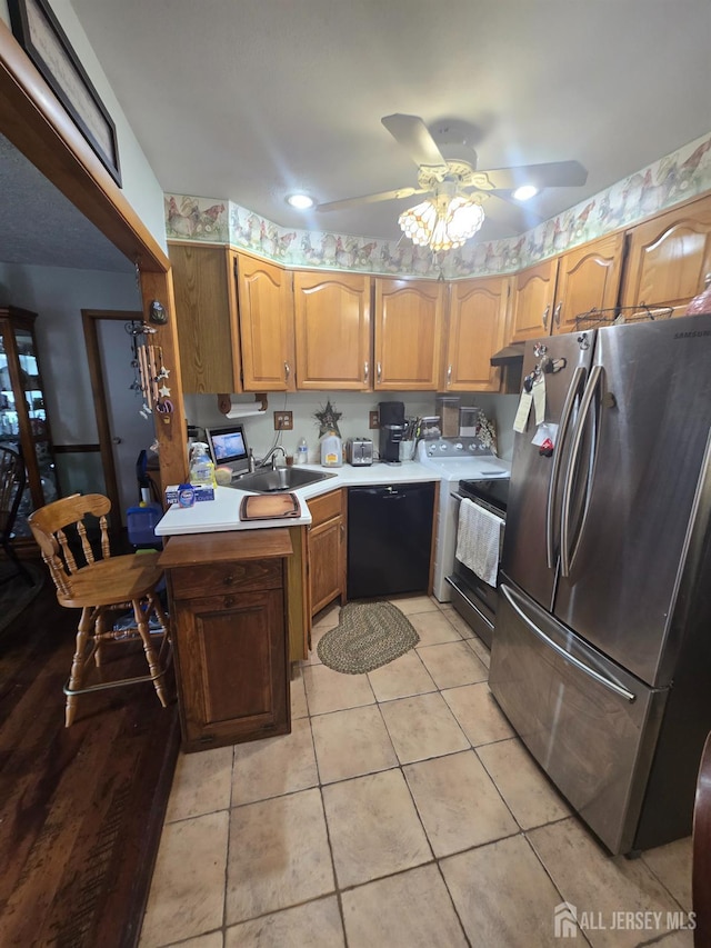 91 Grant Ave, Fords, NJ 08863 - kitchen featuring freestanding refrigerator, dishwasher, stove, ceiling fan, and light tile patterned floors